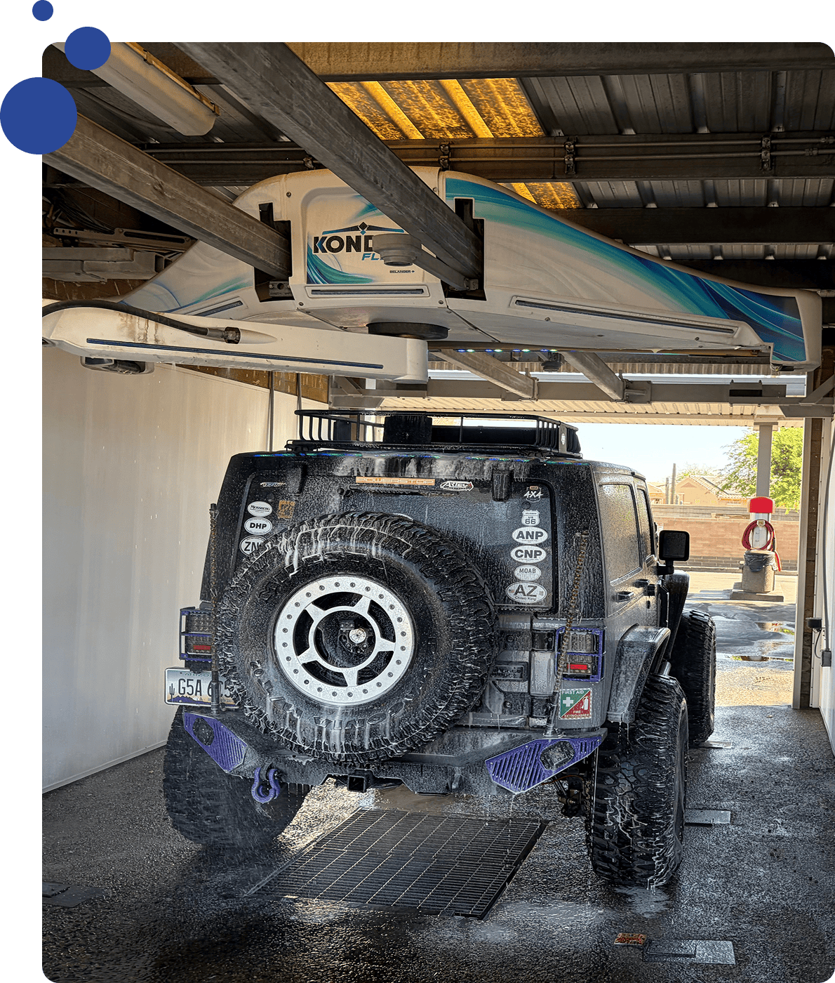 Jeep in automatic car wash station.