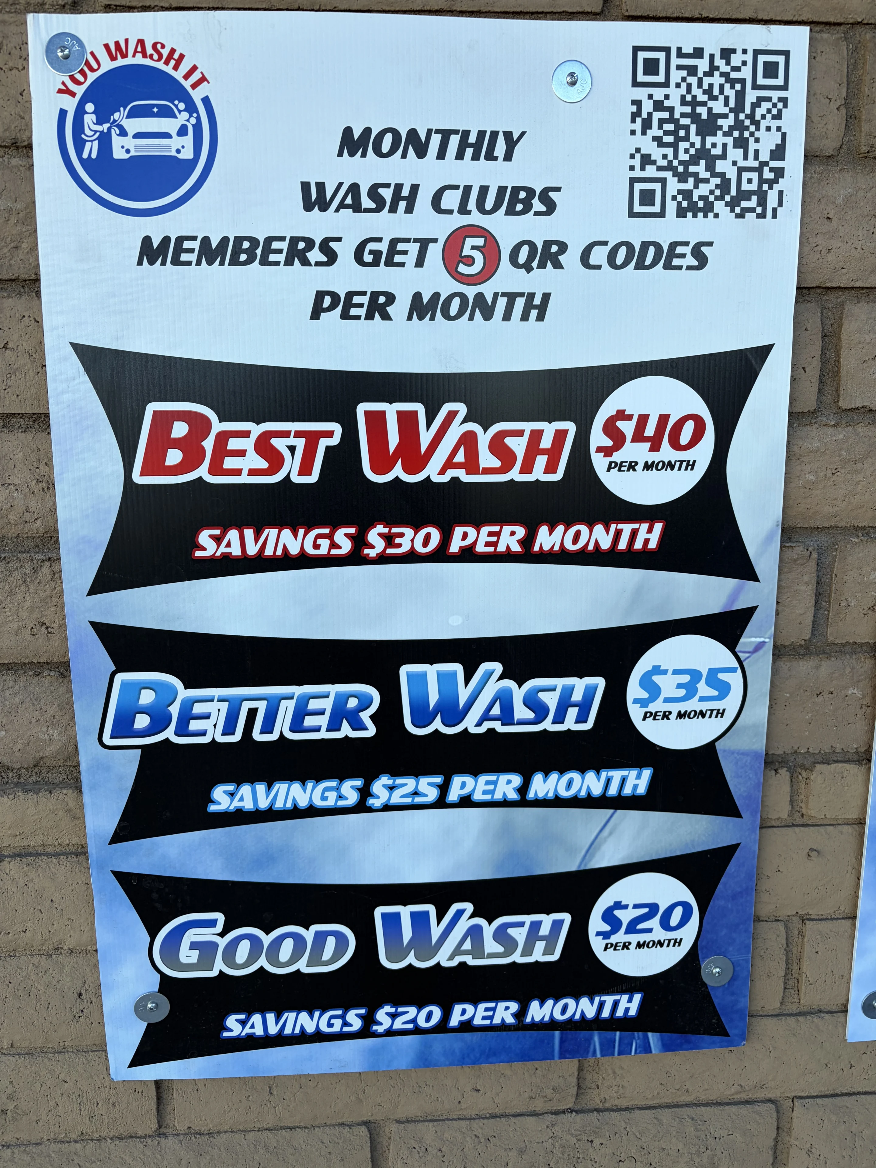 Car wash membership pricing options sign.