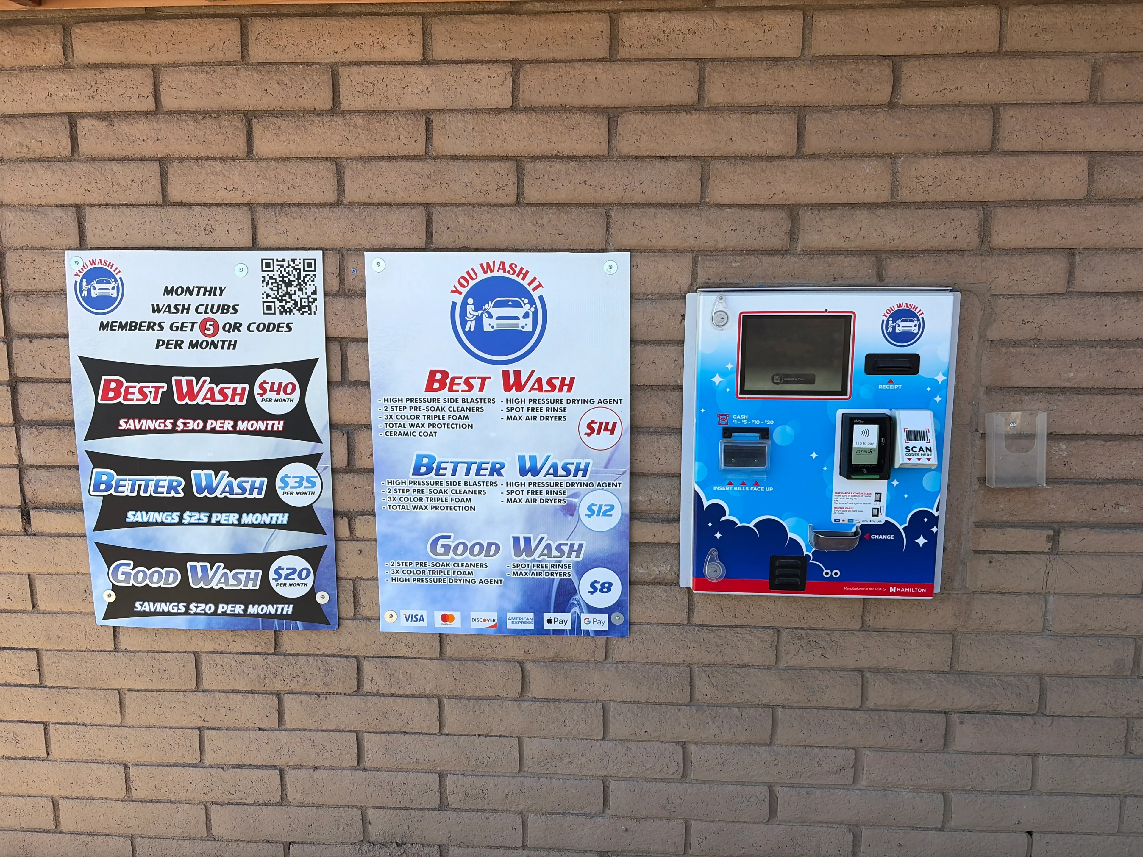 Car wash pricing signs and payment machine.
