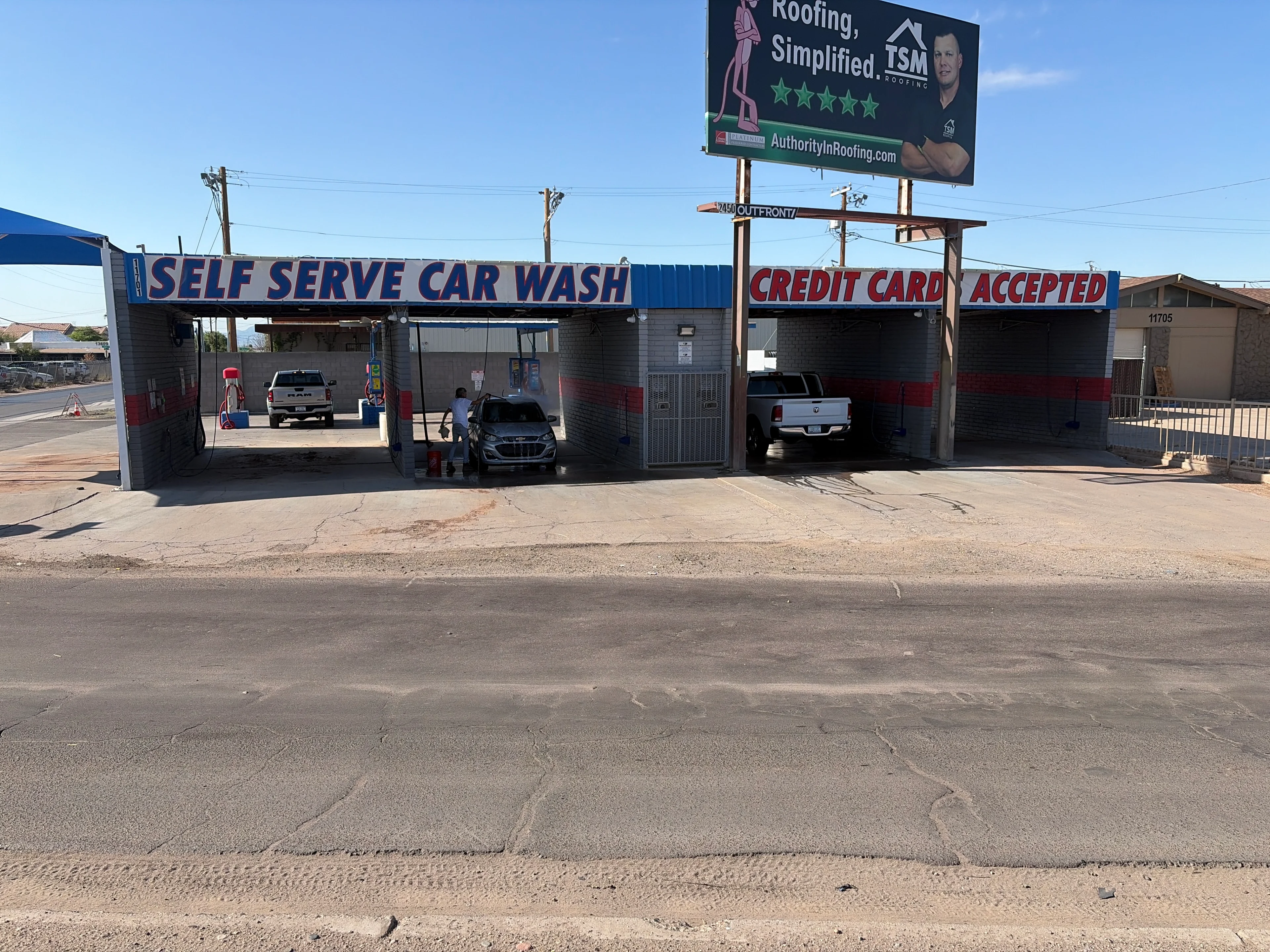 Self-serve car wash with three bays.
