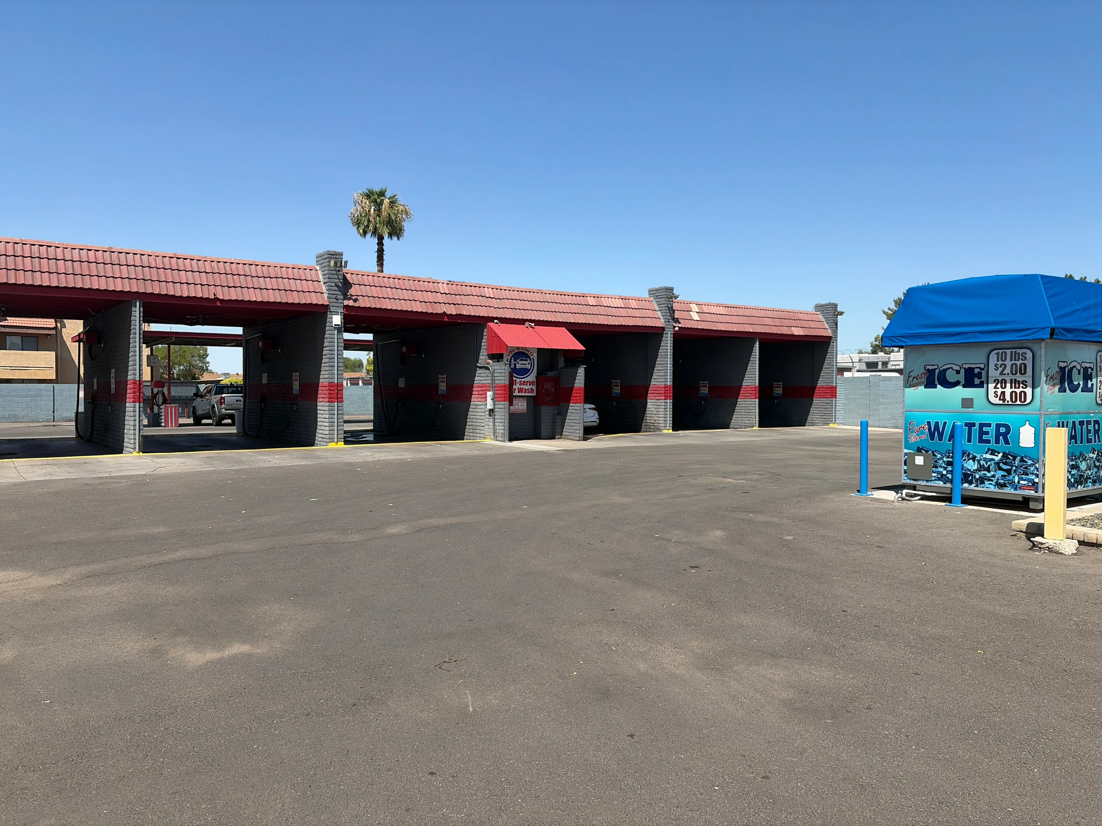Car wash with ice and water kiosk.